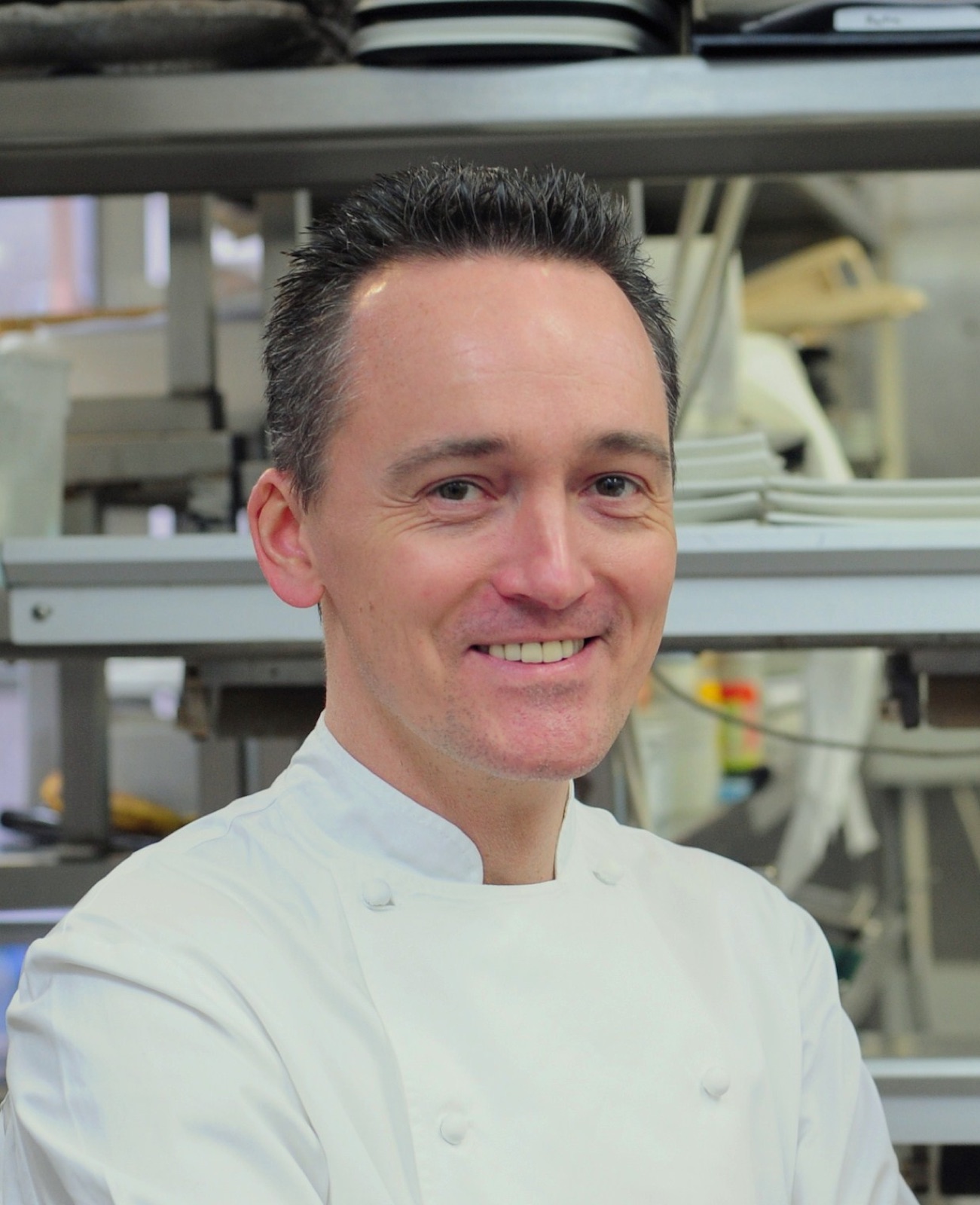 Jérôme Tauvron — portrait in kitchen whites, warm and smiling